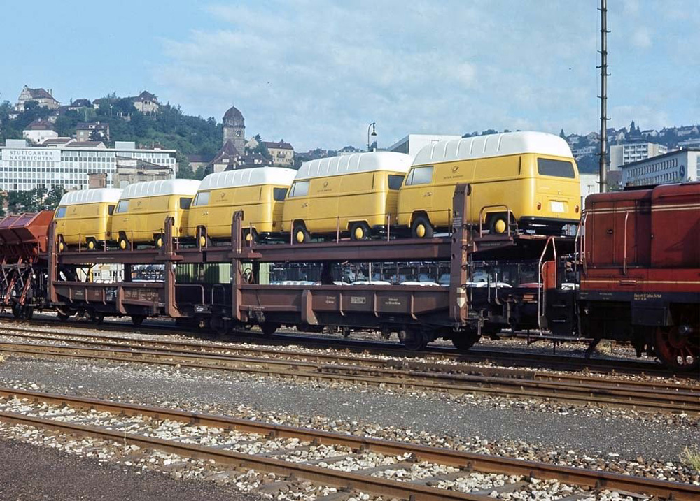 Five T2a Highroofs for the Deutsche Bundespost sitting on a train car in Stuttgart