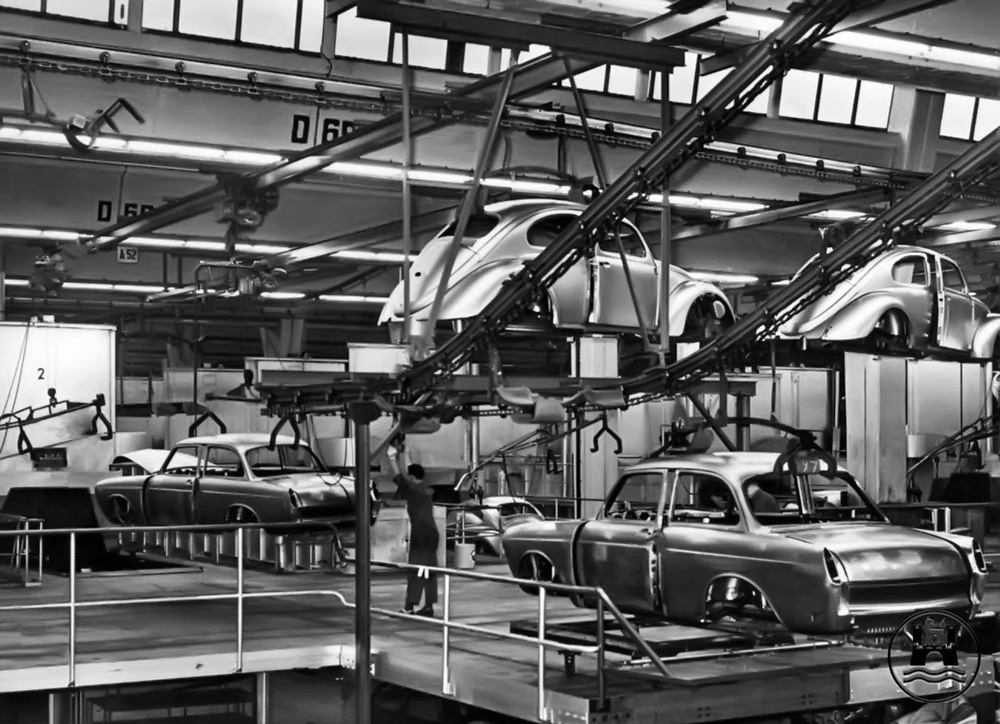 Unpainted 'bodies-in-white' are moved through the Volkswagen factory at Wolfsburg in the early 1960s