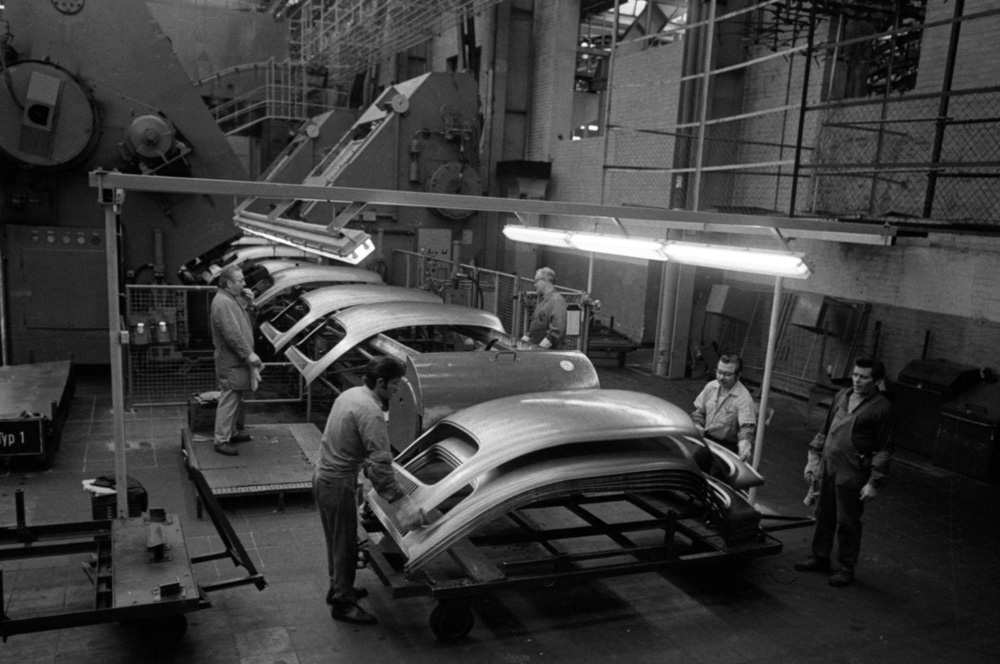 VW 
        1303 roof panels emerge from huge presses that have stamped out