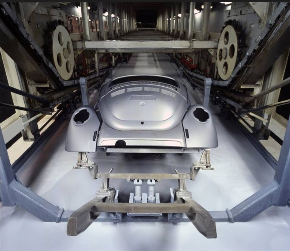 Dipping 
        a bare metal bodyshell of a 'Vocho' at the Puebla plant of Volkswagen