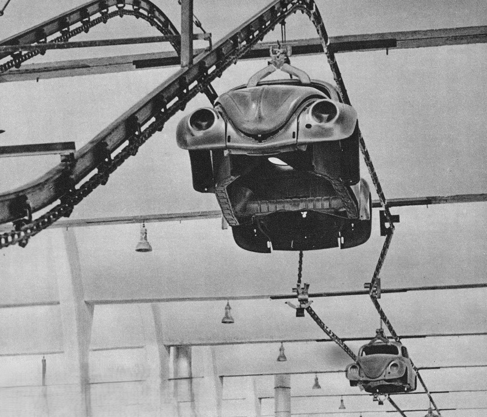 Bare 
        metal bodyshells are transferred by chain conveyor at Volkswagenwerk